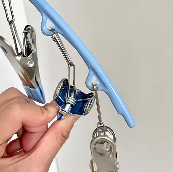 Percha con pinzas para secar y ordenar